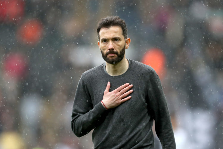 SWANSEA, WALES - MAY 08: Carlos Corberan, Manager of West Bromwich Albion pats his chest as he goes to the travelling West Bromwich Albion fans aft...