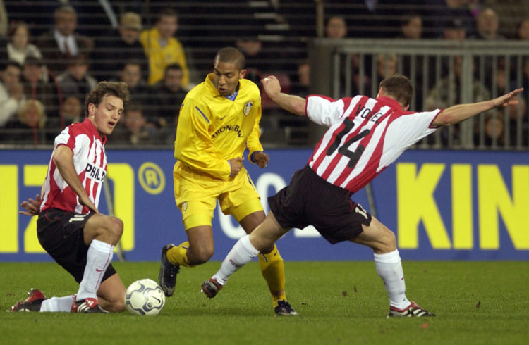 21 Feb 2002:  Olivier Dacourt of Leeds skips through the tackle of Johann Vogel and Arnold Bruggink of PSV during the UEFA Cup 4th Round Match, Fir...