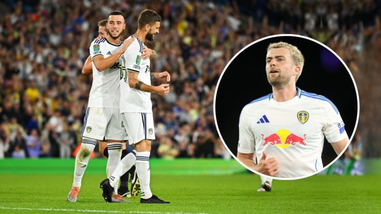 Mateusz Klich of Leeds United celebrates with Sam Greenwood after scoring their team's third goal during the Carabao Cup Second Round match between...