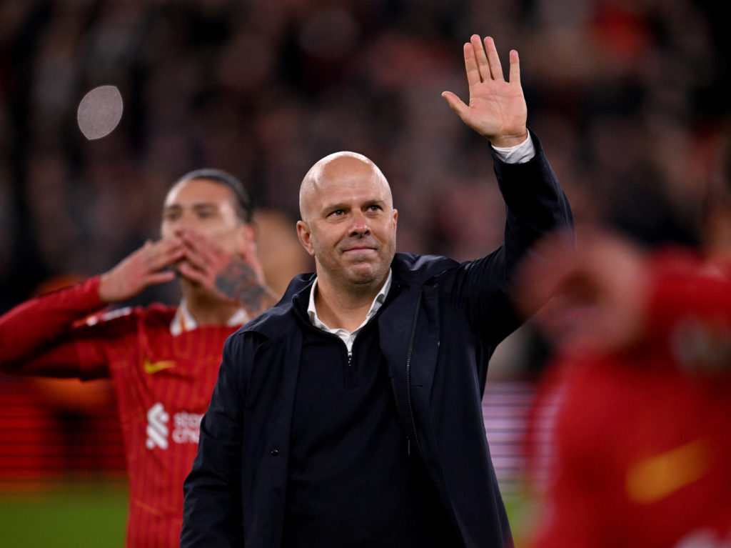 Liverpool manager Arne Slot waves to the fans after a win over Man City.