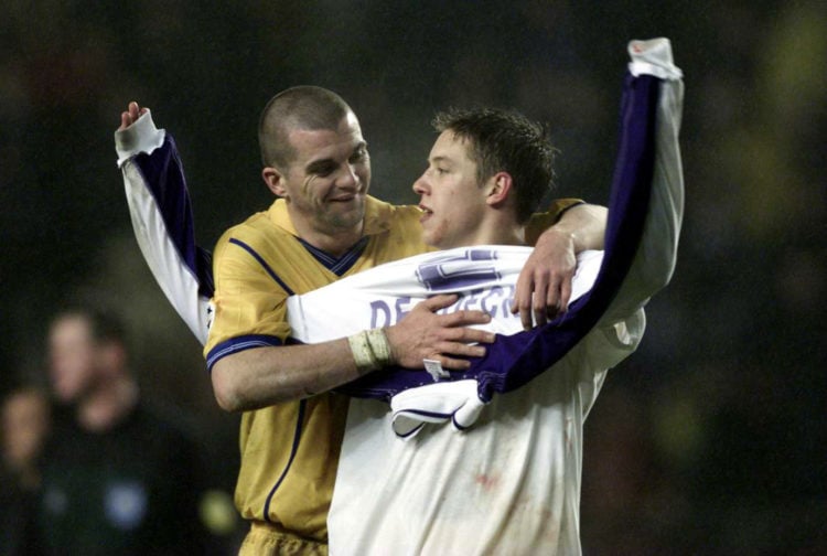 21 Feb 2001: Dominic Matteo of Leeds congratulates two goal hero Alan Smith after beating Anderlecht four-one during the match between RSC Anderlec...