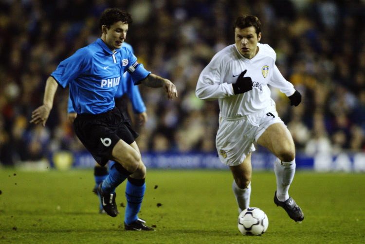 28 Feb 2002:  Mark Viduka of Leeds United takes the ball past Marc van Bommel of PSV Eindhoven during the UEFA Cup fourth round second leg match pl...