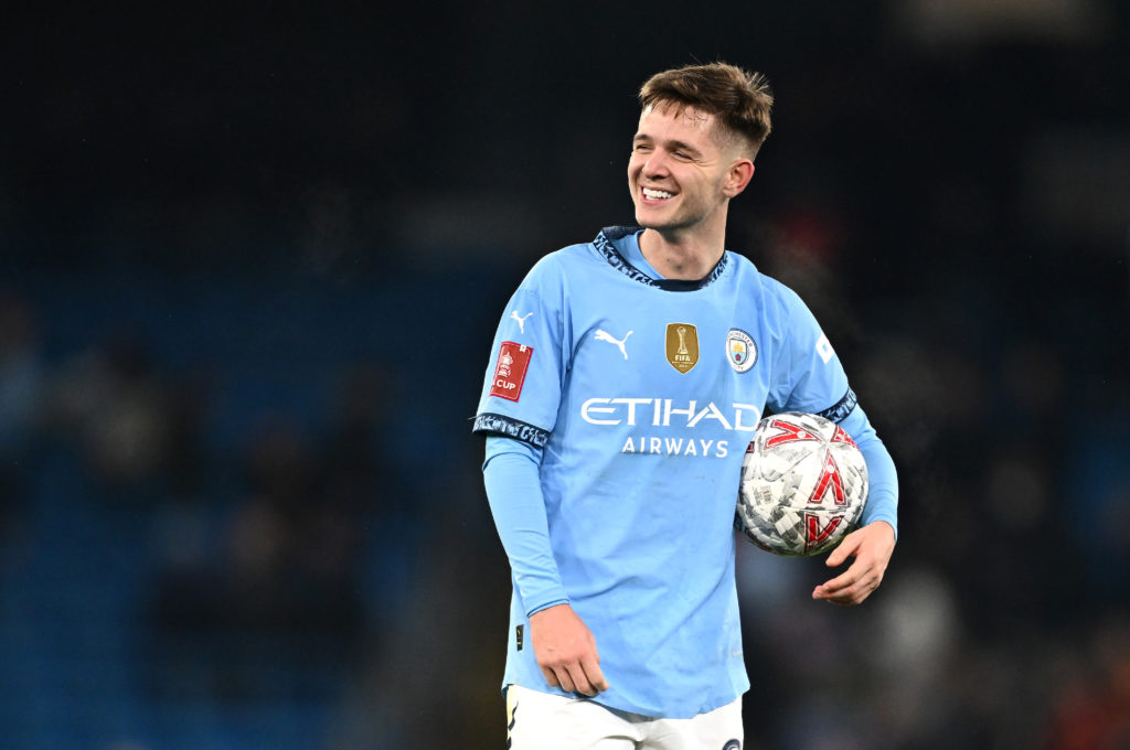 James McAtee holding match ball after Manchester City beat Salford City.