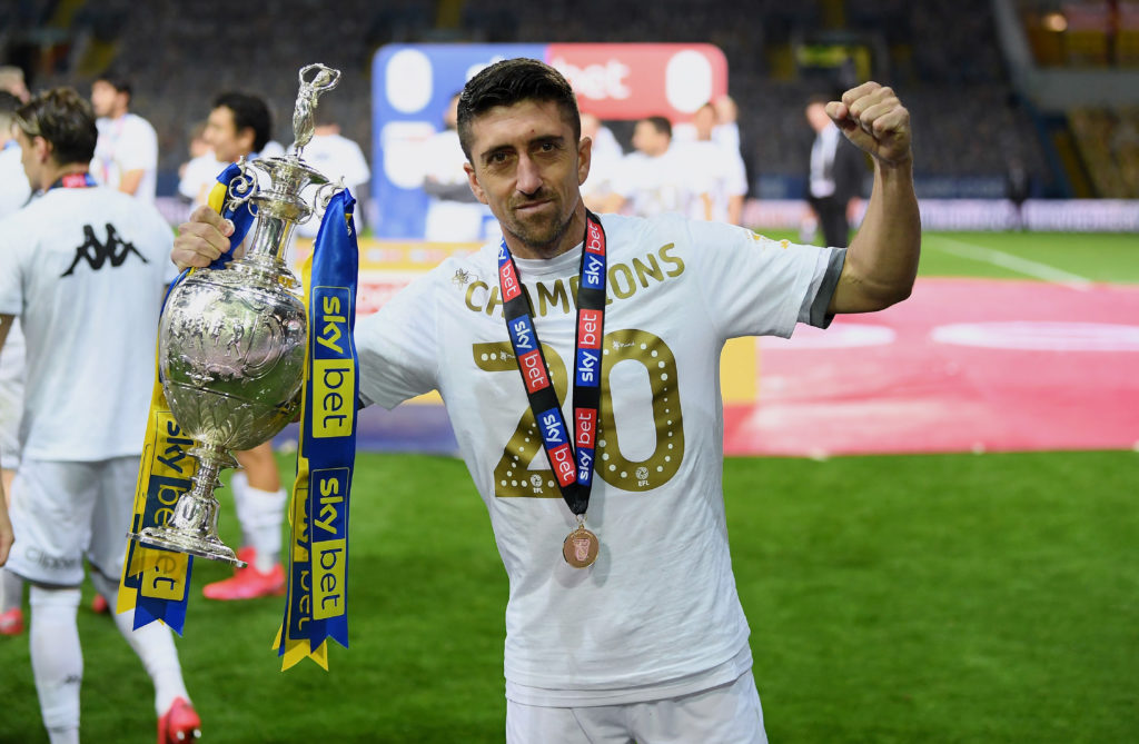 Pablo Hernandez holding the Championship trophy with Leeds United