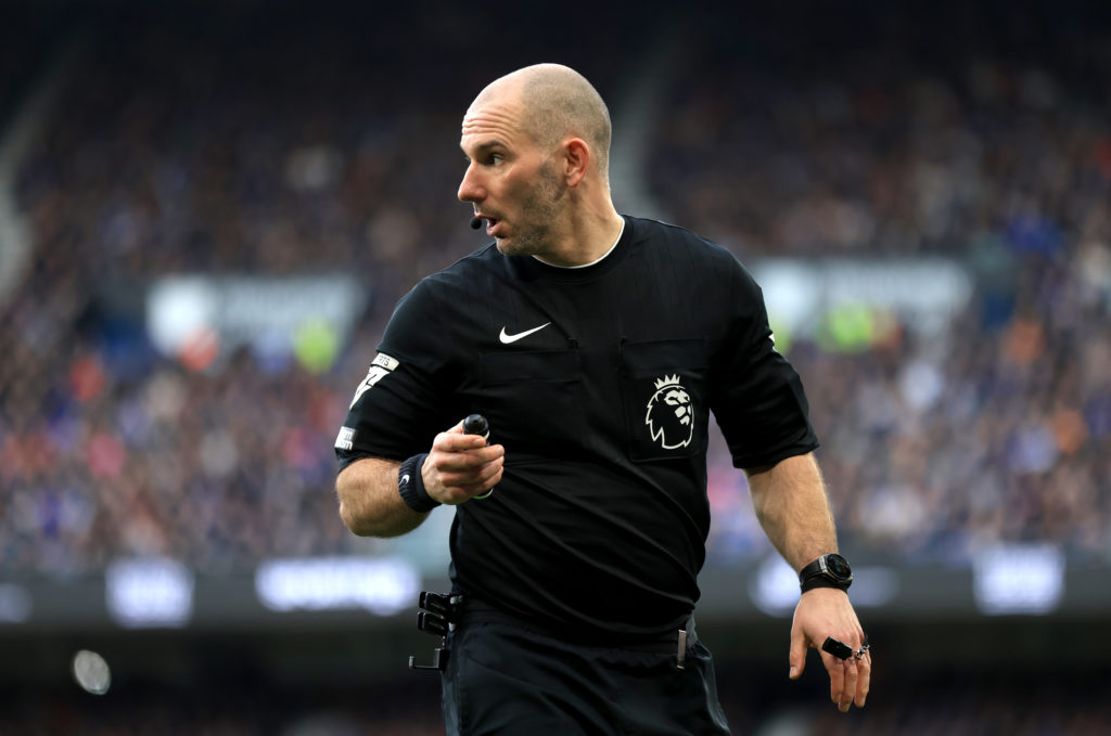 Tim Robinson while refereeing a Premier League clash.