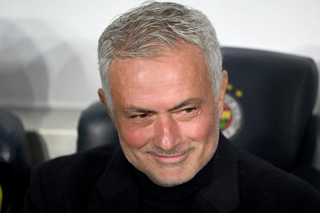 Fenerbahce manager Jose Mourinho smiles on the touchline before a game against Lyon.