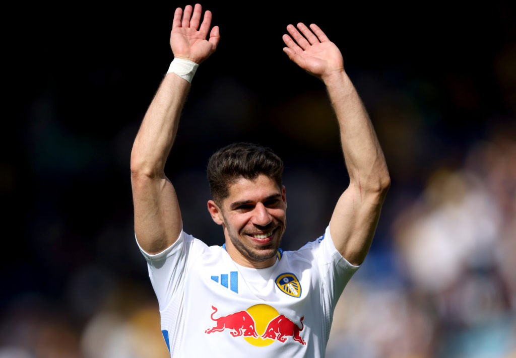 Manor Solomon smiles and holds his hands in the air during Leeds United vs Preston North End.
