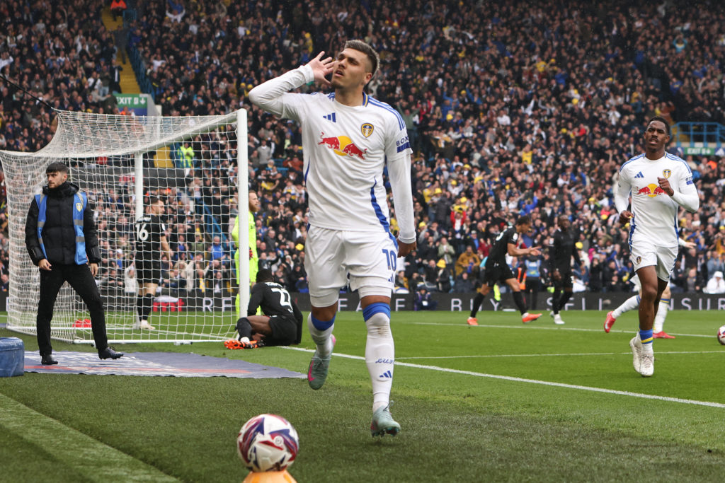 Joel Piroe cups his ear after scoring for Leeds against Stoke.