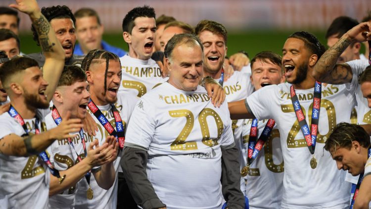 Marcelo Bielsa celebrates with his Leeds United players after winning the Championship in 2020.
