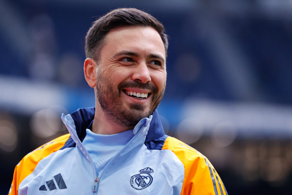 Real Madrid coach Davide Ancelotti smiling.