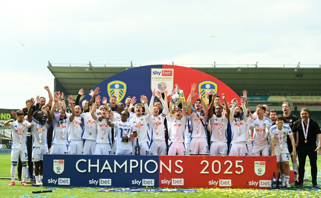 The Leeds United players celebrate winning the 2024/25 Championship title.