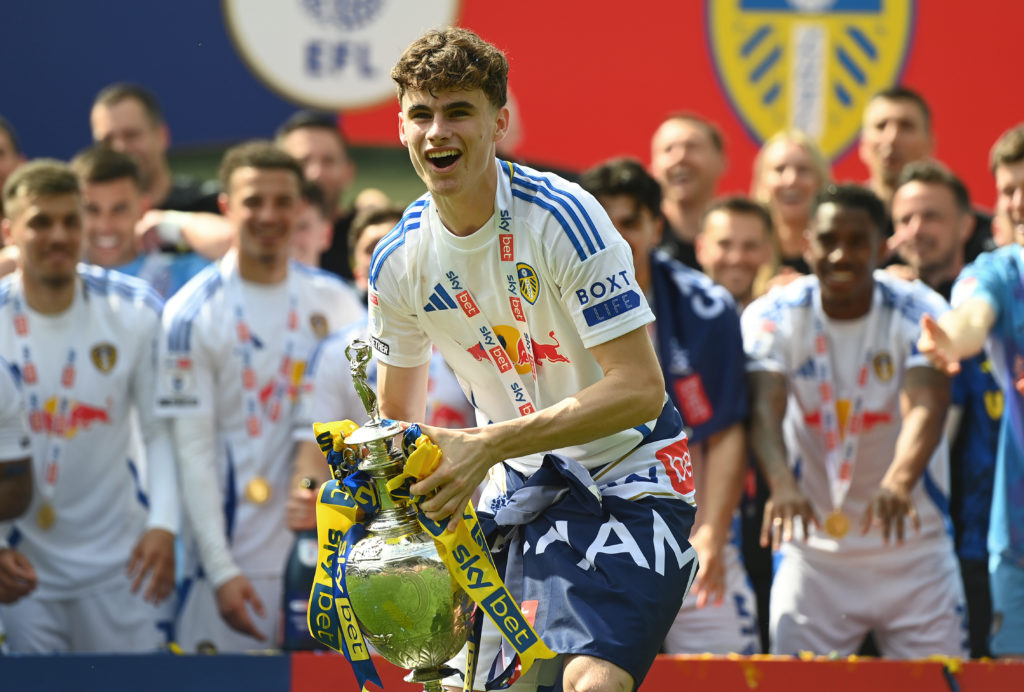 Harry Gray celebrates with the Championship trophy.