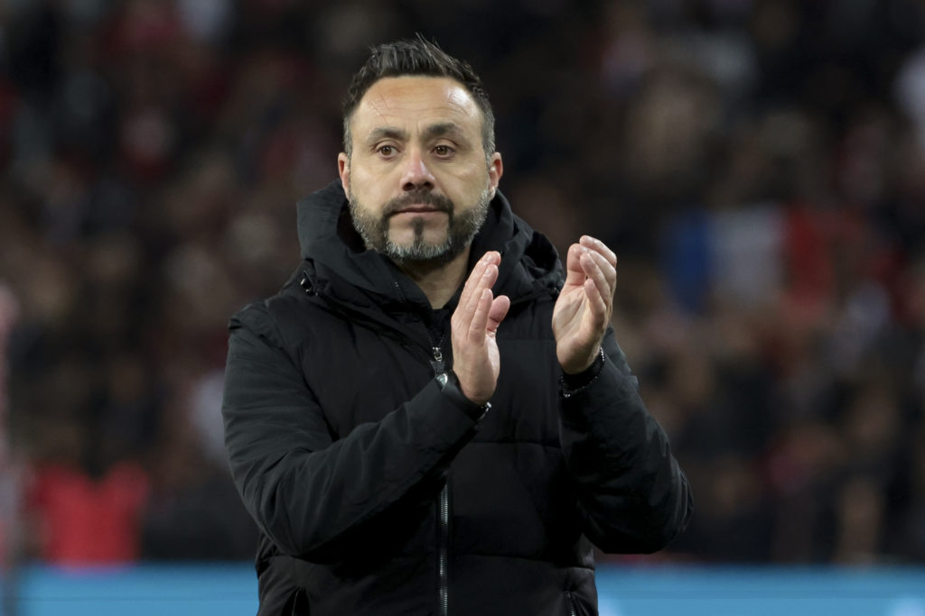 Roberto De Zerbi claps the Marseille support after a game against Lille.