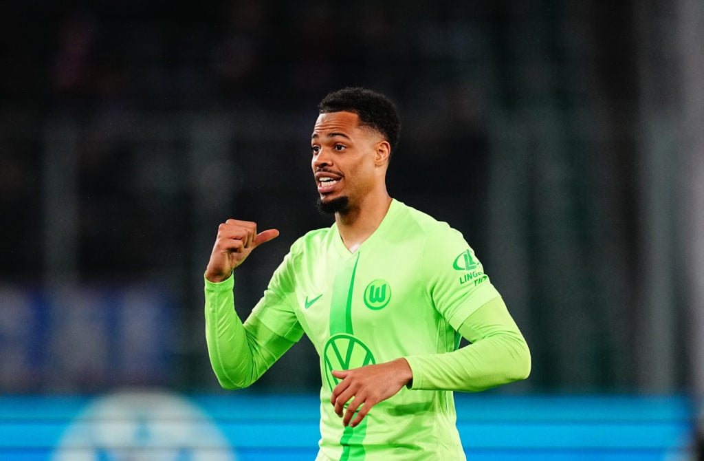 Lukas Nmecha in action for Wolfsburg against Holstein Kiel.