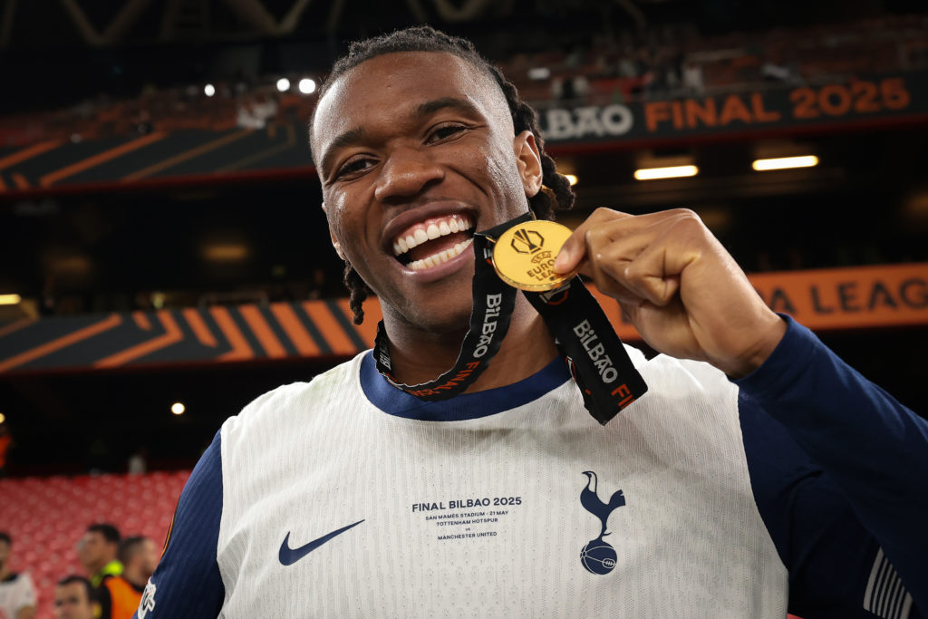 Destiny Udogie shows off his Europa League medal.