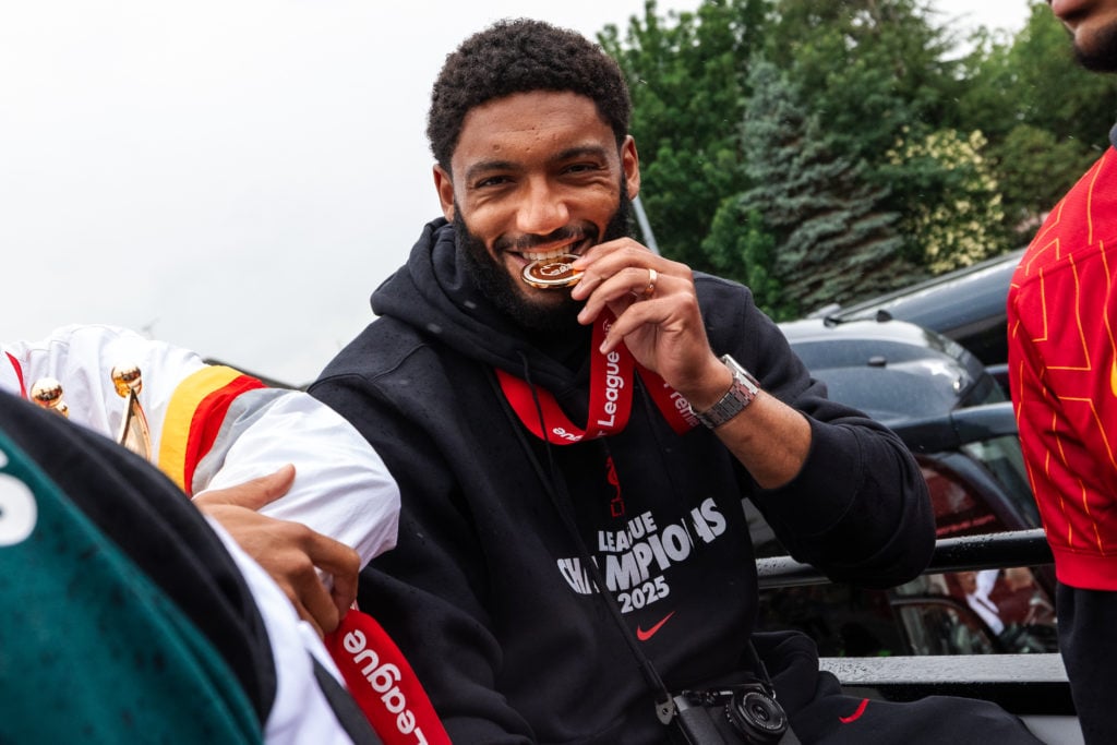 Joe Gomez celebrates with his Premier League medal.