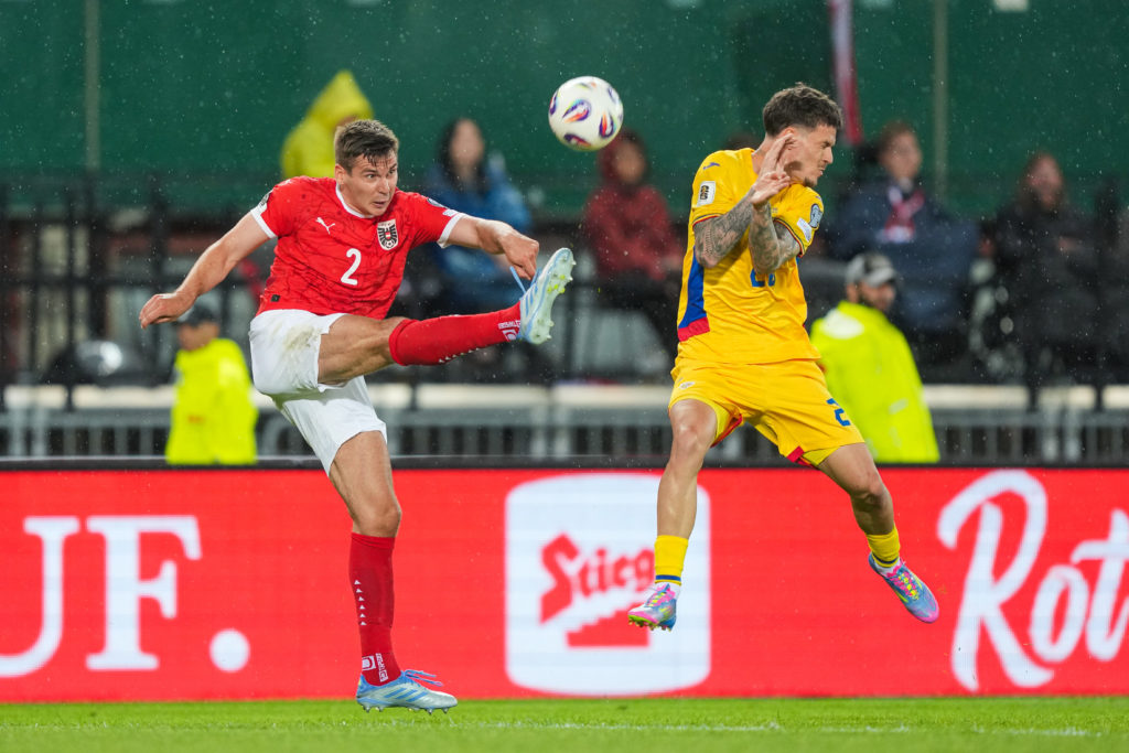 Max Wober clears the ball as Austria beat Romania.