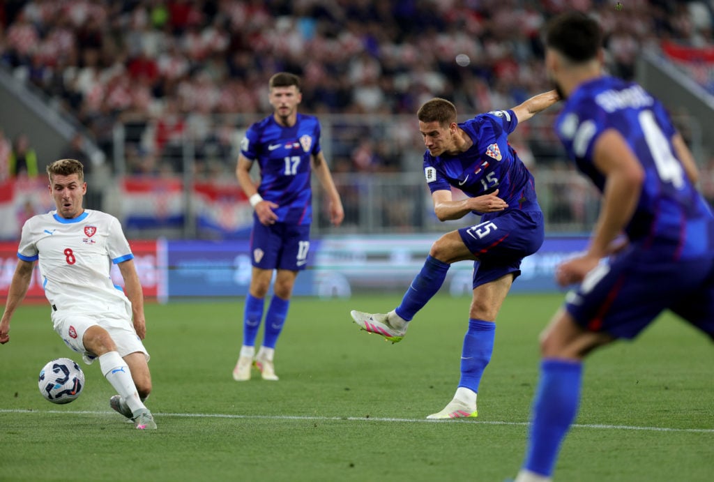 Mario Pasalic shoots for Croatia in a recent match.