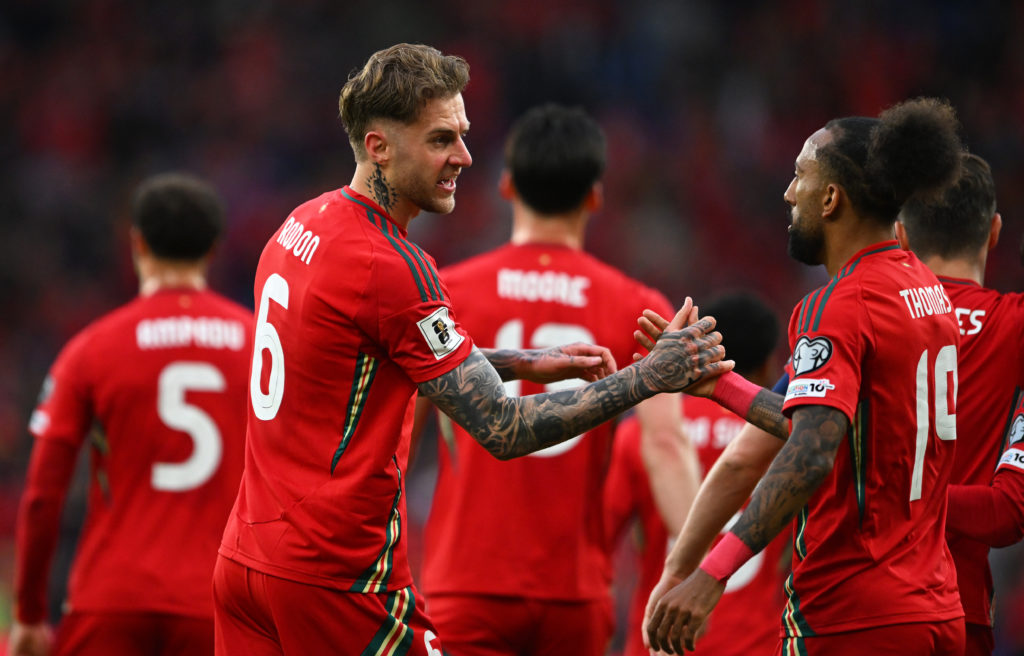 Joe Rodon congratulates Wales teammate Sorba Thomas.