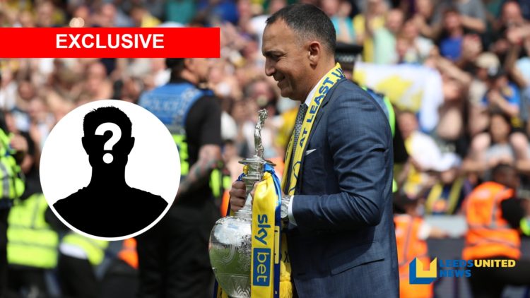 Leeds United chairman Paraag Marathe holds the Championship trophy.