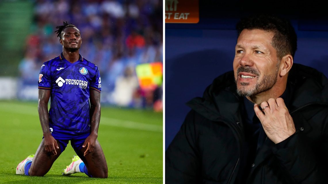 Getafe's Christantus Uche in action as Atletico Madrid manager Diego Simeone looks on.