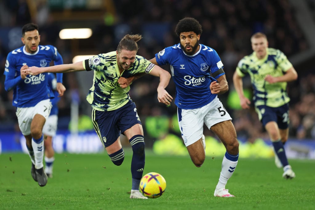 Ellis Simms of Everton is challenged by Luke Ayling of Leeds United .