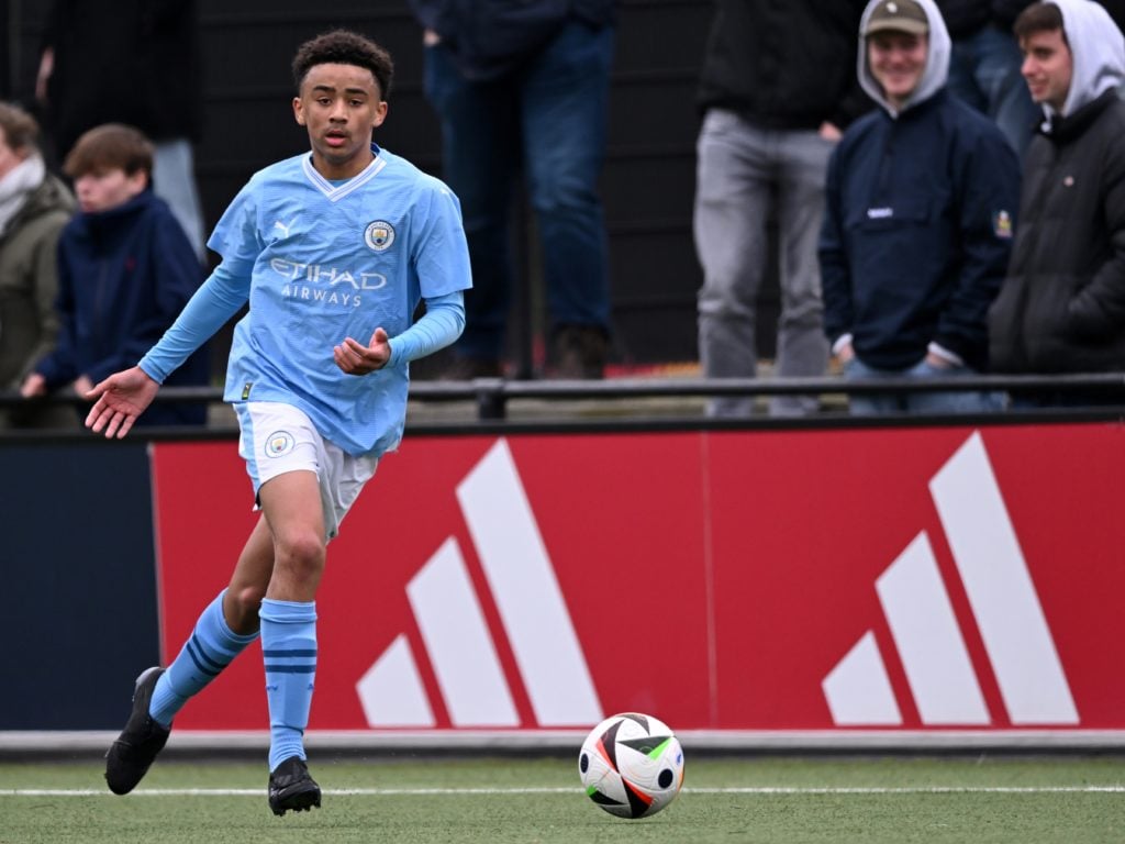Jayden Lienou dribbles with the ball in a Manchester City u17 match vs Ajax.