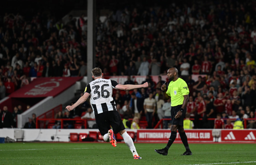 Sean Longstaff celebrates scoring a penalty against Nottingham Forest for Newcastle United.