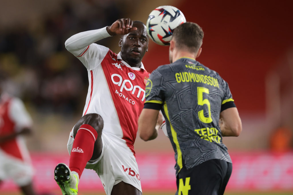 Gabriel Gudmundsson challenges Jordan Teze in a game between Monaco and Lille.