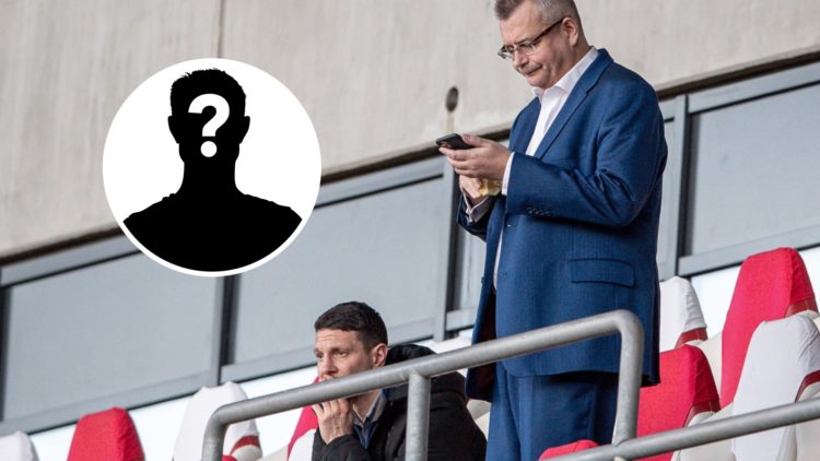 Slavia Prague chairman Jaroslav Tvrdik looks at his phone during a training session.