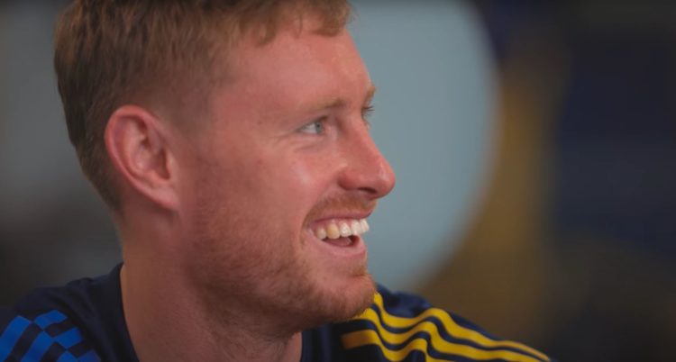 Close up image of Sean Longstaff smiling.