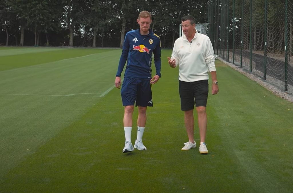 Sean Longstaff walks with Michael Bridges at Leeds United's training ground.