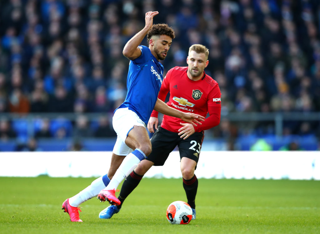 Dominic Calvert-Lewin and Luke Shaw tussle for the ball.