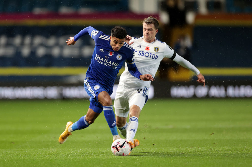 James Justin taking on Patrick Bamford during Leeds United v Leicester City.