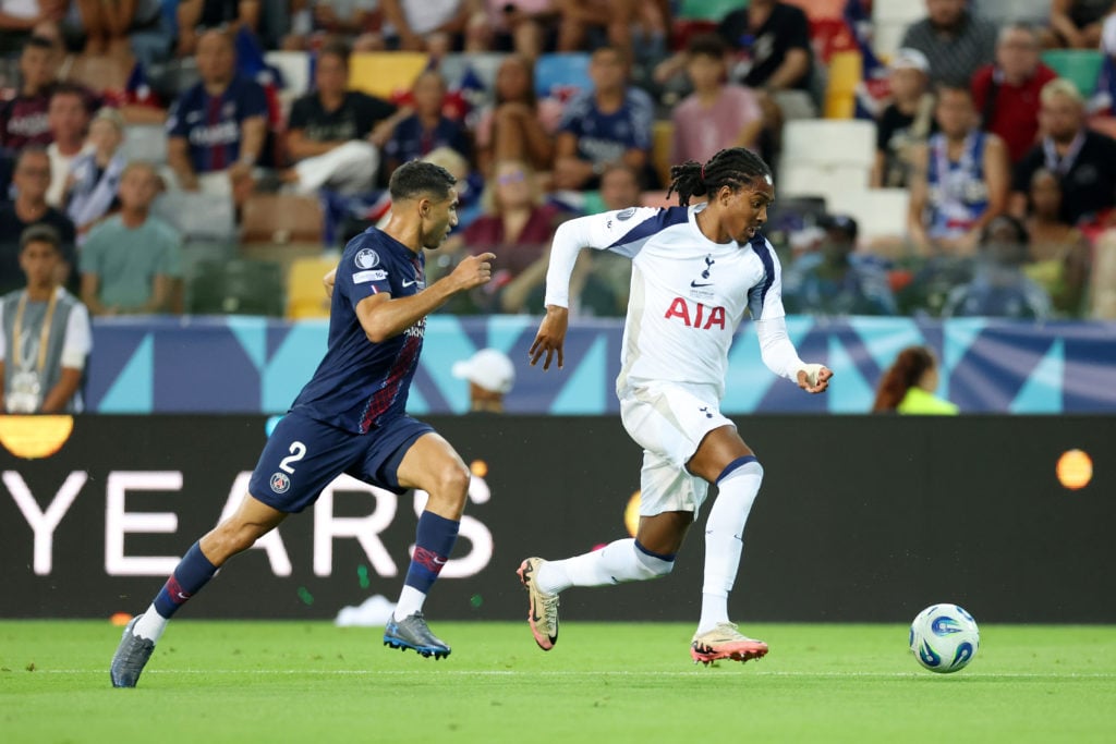 Djed Spence runs with the ball during Paris Saint-Germain v Tottenham Hotspur - UEFA Super Cup 2025
