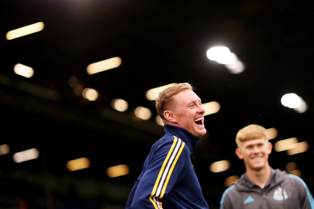 Sean Longstaff of Leeds United inspects the pitch.