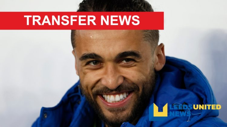 England player Dominic Calvert-Lewin laughs while sitting on the bench.