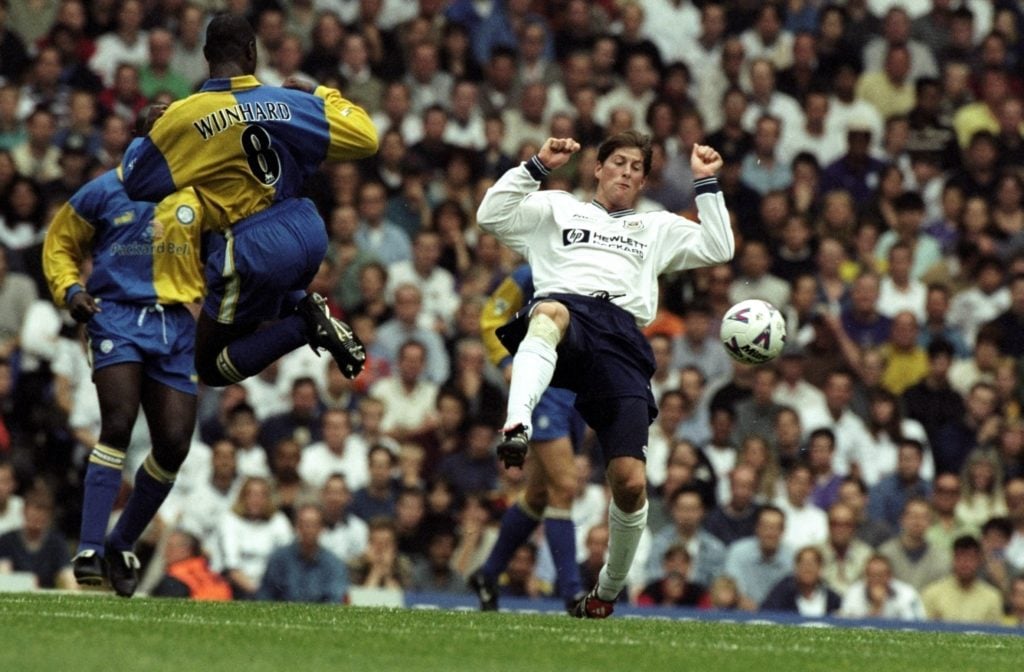 Darren Anderton of Tottenham Hotspurs facing a leaping Clyde Wijnhard of Leeds
