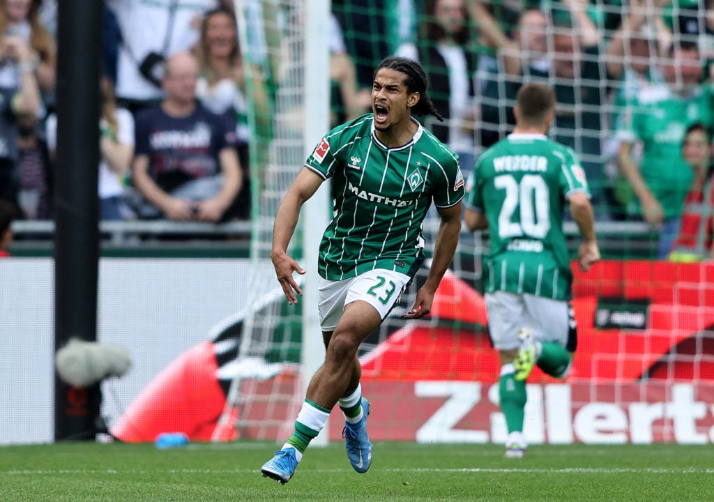 Isaac Schmidt celebrates scoring for Werder Bremen.