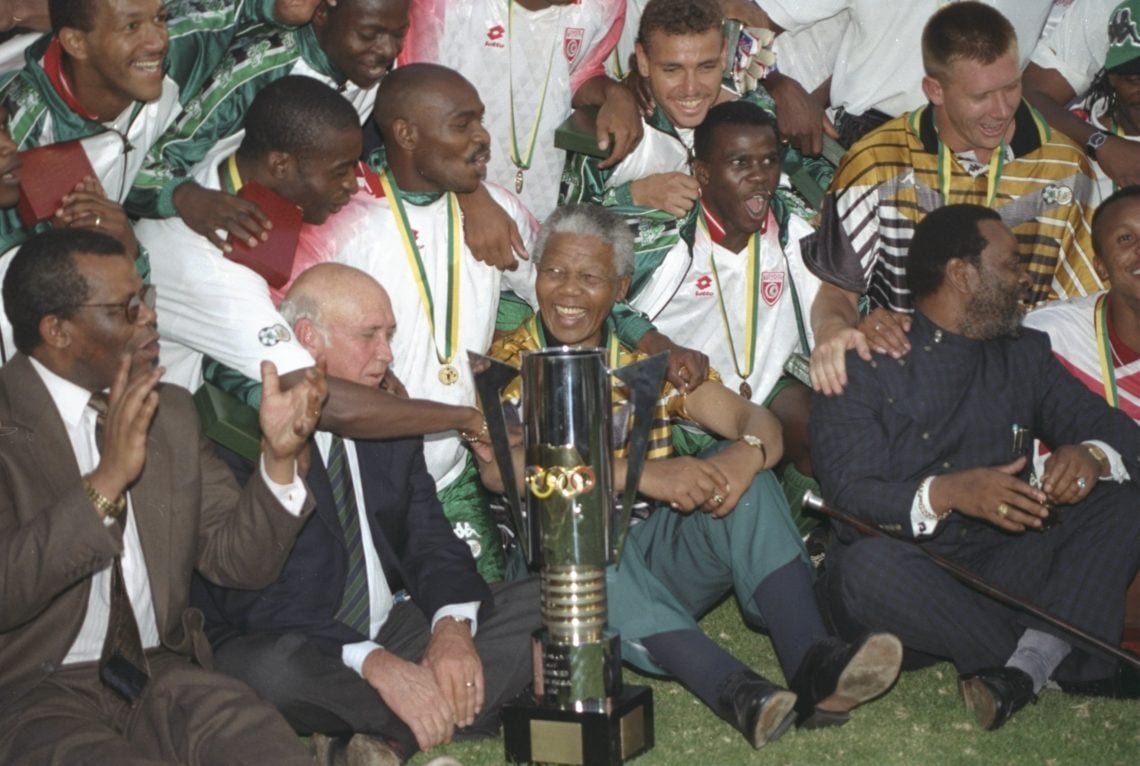 3 Feb 1996: President Nelson Mandela celebrates with the South African players after their victory in the African Nations Cup Final against Tunisi...