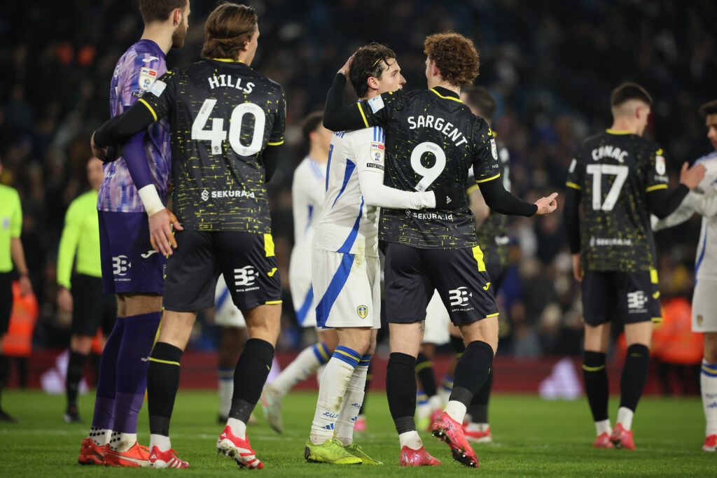 Brenden Aaronson and Josh Sargent embrace after a Championship clash between Leeds and Norwich