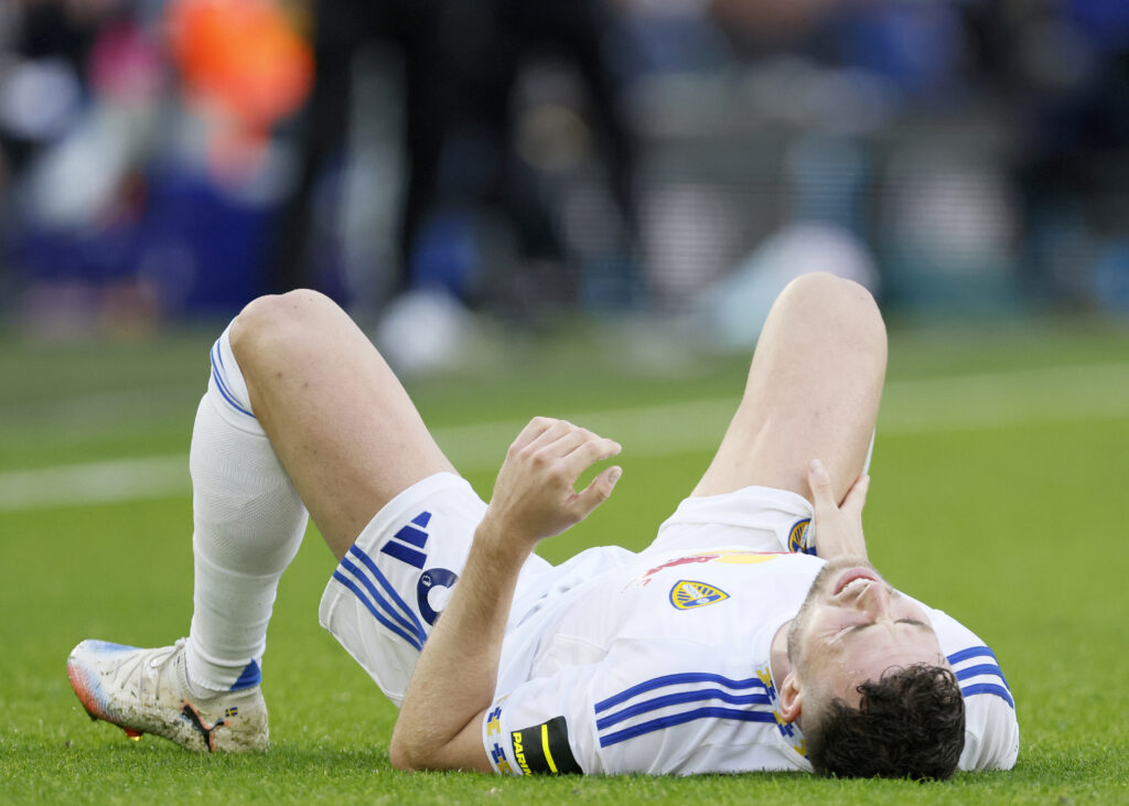 Gabriel Gudmundsson lies on his back in pain.