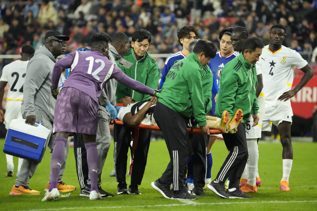 Francis Abu is stretchered off during Japan v Ghana - International Friendly