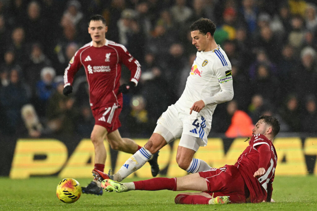 Conor Bradley tackles Ethan Ampadu.